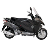 Coprigambe Termoscud®, un coprigambe impermeabile con fodera termica. In uso su scooter. Di TUCANO URBANO.